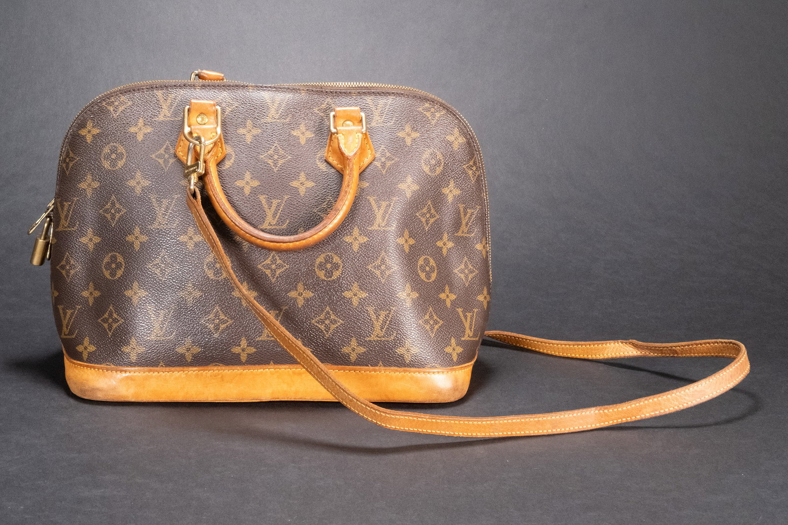Louis Vuitton Aima w/ Strap and Lock Bag: Louis Vuitton Aima with Strap and Lock Shoulder evening Purse Width (at base): 12"Height: 9.5"Depth: 6"Handle Drop: 4"Circa: 1996Type of Material: Coated Canvas, LeatherColor: BrownLining: Brown Fine 