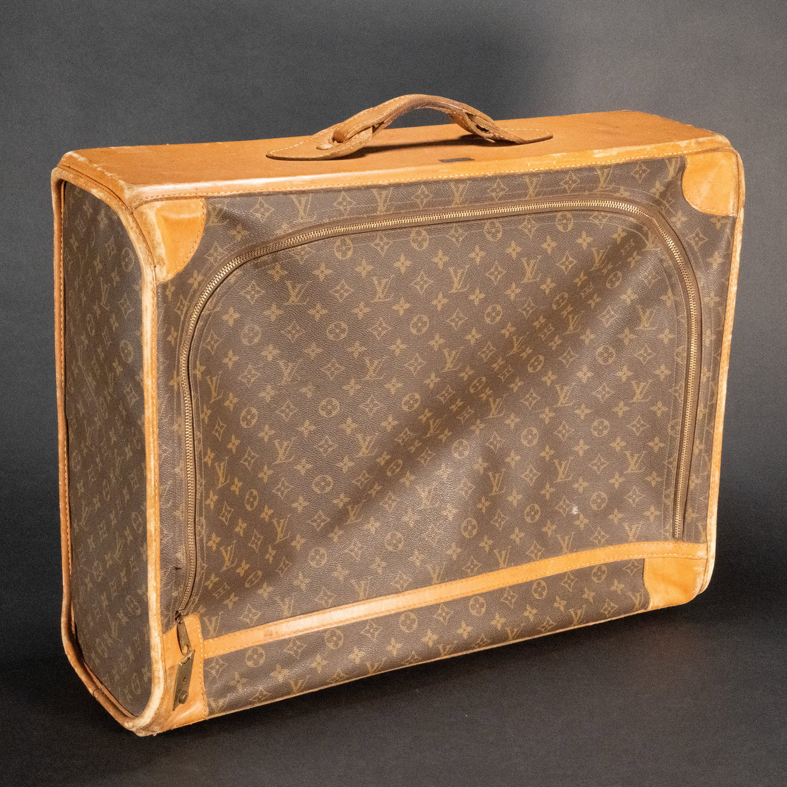 Louis Vuitton Vachetta Suitcase Luggage: Louis Vuitton Vachetta Suitcase Luggage LV Logo Pattern Vachetta Sides With leather handle and TrimIt has the Saks Fifth Avenue Metal Tag on the TopThe zipper is made by TALON. The key is missing. Dim