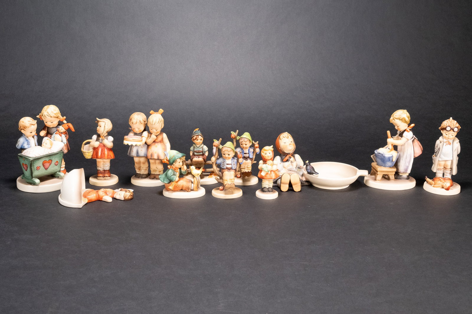 Hummel Figurine Large Collection Group Lot: Hummel Porcelain Figurine Large Collection Grouping Lot #333 Happy Birthday Blessed Event #142 Apple Tree Boy 3.25" Tall, #127 Doctor Figure 5" Tall Happy Birthday Hummel 5.25" Tall The Blessed Event 