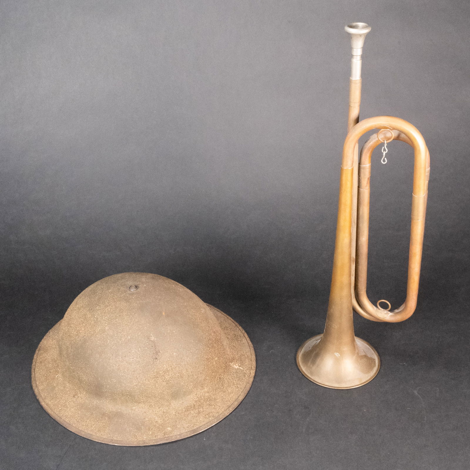 WWI US Marine Corps M1917 Doughboy Helmet w/ Camo Textured Paint & Bugle: WWI American Marine Corps M1917 Doughboy Helmet with Camouflage Textured Paint and Musical Instrument Trumpet Bugle This very nice example is complete with a partial liner and complete chinstrap, and