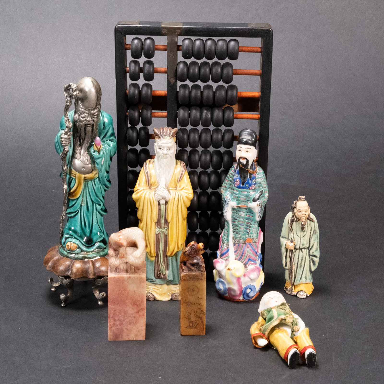 Chinese Ceramic Collection Group Lot Figure Seals Abacus etc: Chinese Porcelain Figures Soap Stone Seals Bisque Baby Doll Losely Jointed Clothed in Yellow And Green Chinese God Of Longevity 7" Tall Italian Zaccagnini Terra Cotta Enamel Immortal Figure 8" Tall Wi