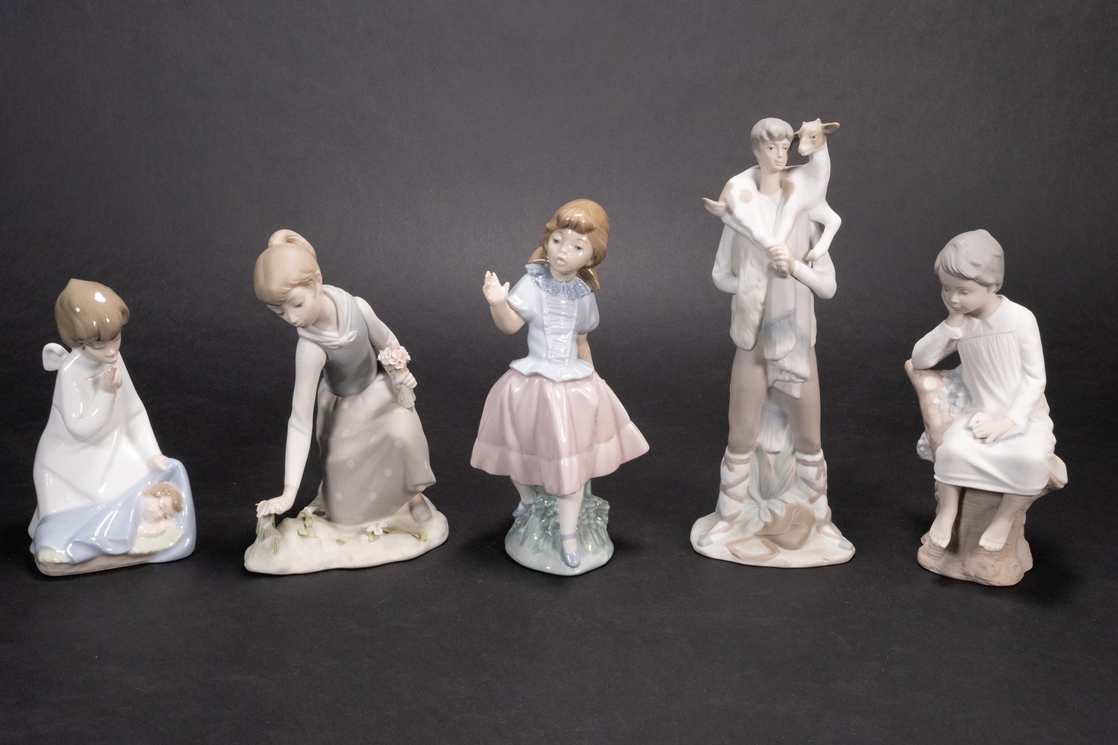 Lladro Porcelain Sculpture Group Lot: Lladro Ceramic Figurine Grouping Colection Lot Each Stamped Underneath Base Lot Comprising: 1x 1977 Lladro Nr # 4635 Angel with Baby Matte Polish Approx 6 1/2"H x 4"L x 3 1/2"W 1x Girl Picking Flowers