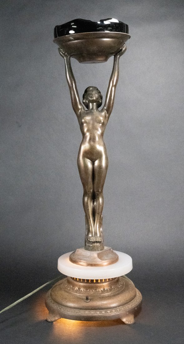 Frankart American Art Deco C 1920's Gilt Bronze Figural Cigar Ashtray Lamp: Frankart Circa 1920's American Art Deco Gilt Metal Figural Nude Cigar Ashtray Lamp Sculpture Depicting Nude Woman Holding Ashtray Above her Head with Lighted Milky Glass Base with Black Glass Cigar As
