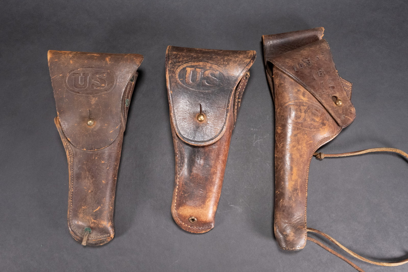 WWI Militaria Collection Lot Gun Leather Holster: WWI Military Pistol Leather Holsters #1 Rock Island Arsenal 1908 T.C.C. Leather Holster With US Stamped and Other Markings on Flap #2 WWI Sears 1917 US Army Colt .45 Holster Stamped US on The Front An