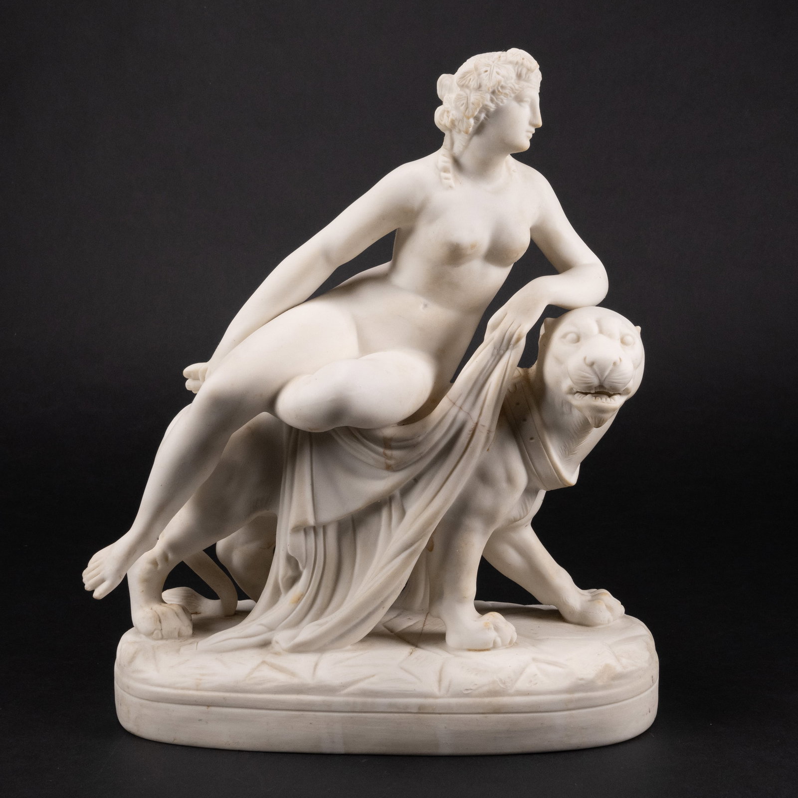 19th c. Parian Porcelain "Ariadne on a Panther" Statue: 19th C Parian Porcelain " Ariadne On A Panther " Statue Depicting a Nude Female Lady Resting on Panther Holding a Shawl approx: 11 3/8"H x 9 3/4"L x 5" W In Overall Good Condition Please Look at Photo