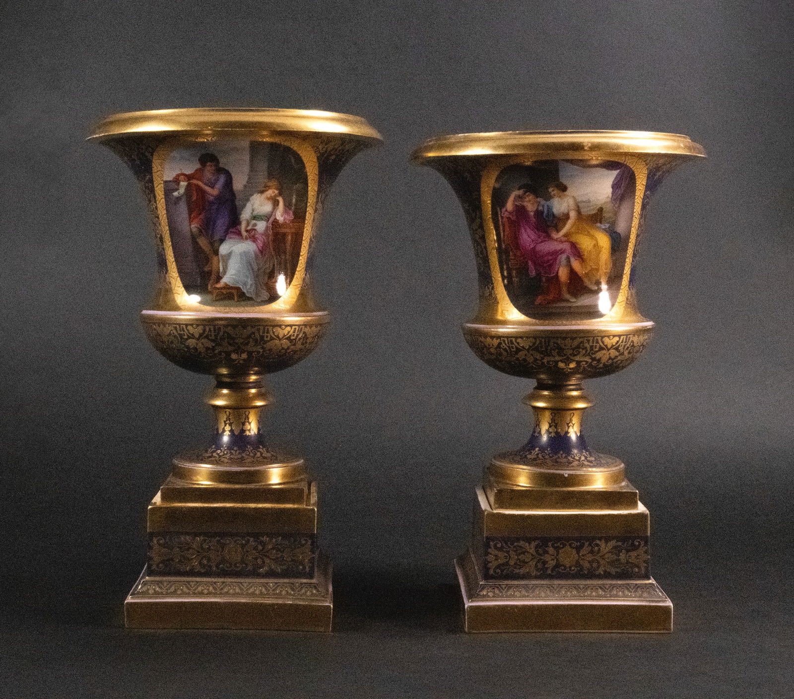 19th c. Royal Vienna Urn Pr.?: Victorian 19th Century Royal Vienna Porcelain Garniture Set Pair of Potpourri Urns on stands cobalt blue with hand painted courting scenes and elaborately raised gilt floral sprays throughout each wit