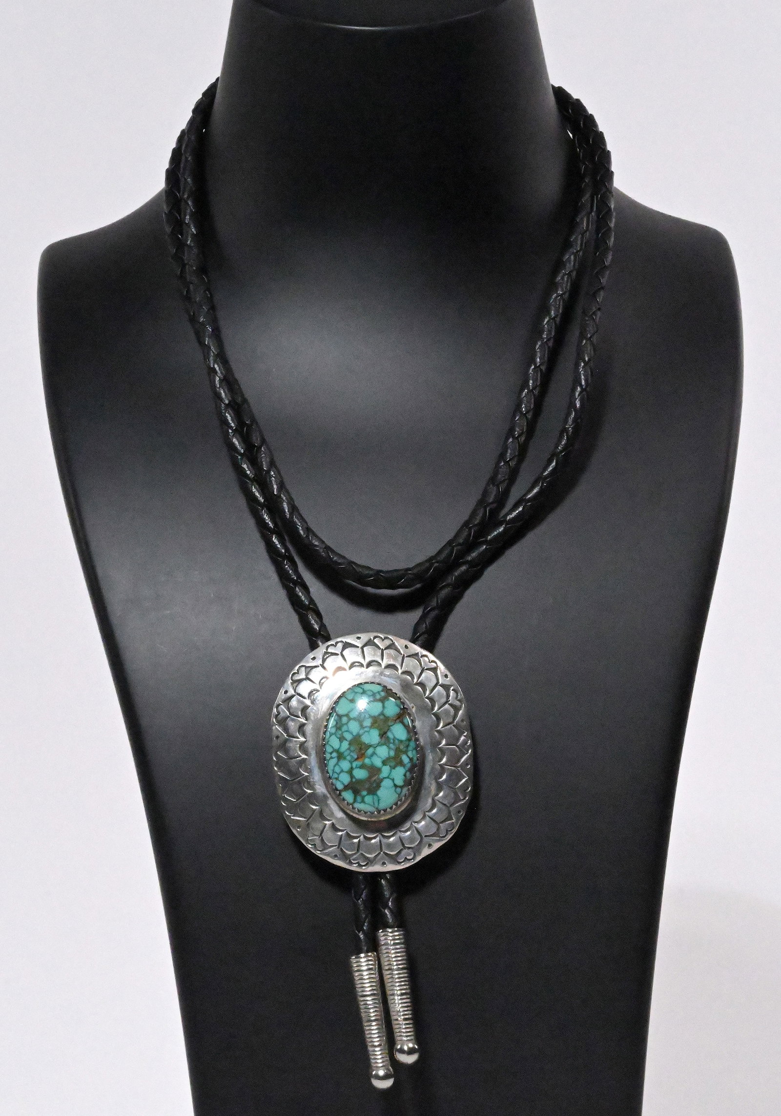 Navajo Native American Large Kingman Turquoise Sterling Silver Bolo Tie: Navajo Tribe Native American Large Kingman Turquoise Sterling Silver Bolo Tie with Bezel Set Gemstone in Center Etched in Traditional Navajo Motif of Crescent Moons? Teepe Flying Bird Sterling Cones t