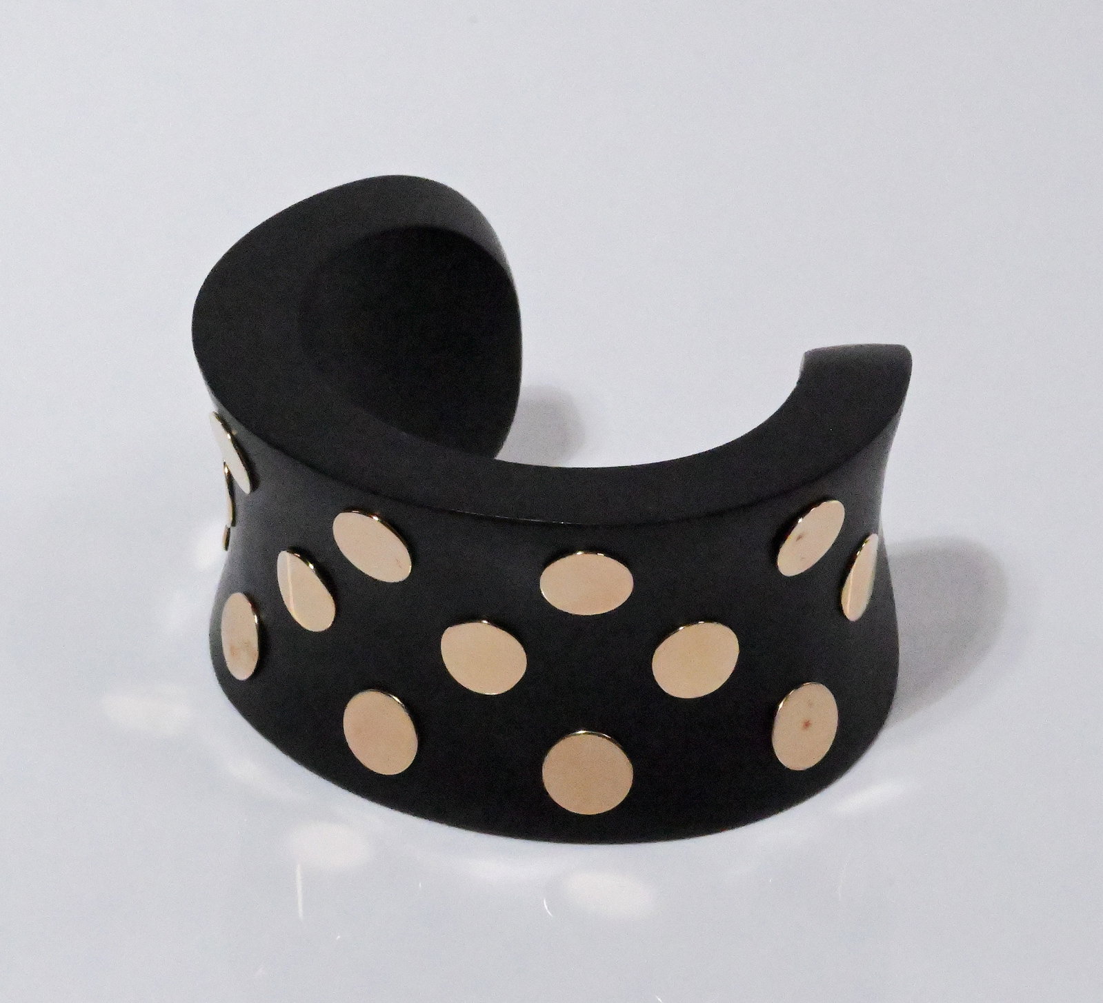 14K Gold Ebony Wood Cuff Bracelet: 14K Gold Ebony Wood Cuff Bracelet Ebonized Wood Adorned with Three Rows of Round 14K Gold Plaques Approx: 9/16"W 7/16"Thick Interior: 2 3/16"L Gap: 1 3/8"L In Overall Good Condition Please look at Pho