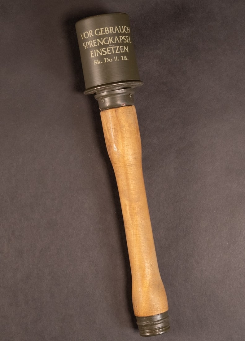 WWII German Practice Potato Masher Stick Grenade Inert: WW2 German practice " Potato Masher " Stick Hand Grenade Measures 13 5/8 inches long by 2 1/2 inches in diameter The top of the can is stamped with " RR564 1943 " and has a Waffen eagle clutching a sw