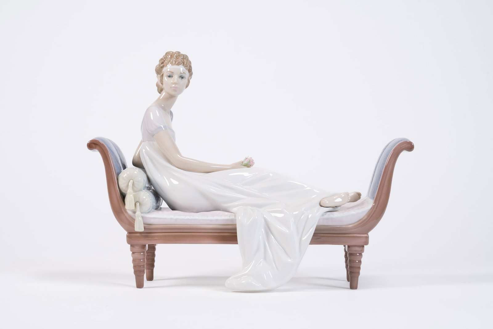 Retired Lladro "Intermezzo Chaise Lounge" 5424 Porcelain Sculpture: Retired Lladro " Intermezzo Chaise Lounge " 5424 Porcelain Sculpture Depicting Elegant lady Resting Relaxing on a Chaise Holding Rose Flower Glazed Hand Made Stamped to Underside with Cobalt Blue Make