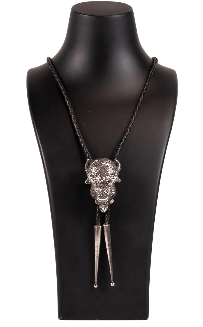 Navajo Native American Sterling Silver 3D Bison Bolo Tie: Navajo Tribe Native American Sterling Silver Bison Bolo Tie Hand Made Three Dimensional Engraved Bison Buffalo Head on Braided Lether Terminating to Both Ends with Sterling Silver Cones Makers Hallmar