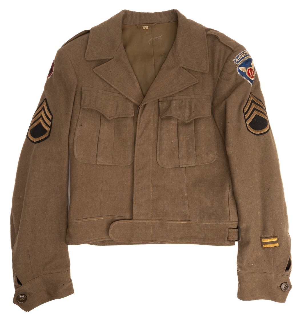 WWII US Army Field Jacket Staff Sergeant 11th Airborne 27th Infantry Division: Exceptional and Highly Desirable World War II Era United States American Army Field Jacket That Belonged To A Staff Sergeant Featuring Noncommissioned Officer Rank Insignia with Staff Sergeant Chevron