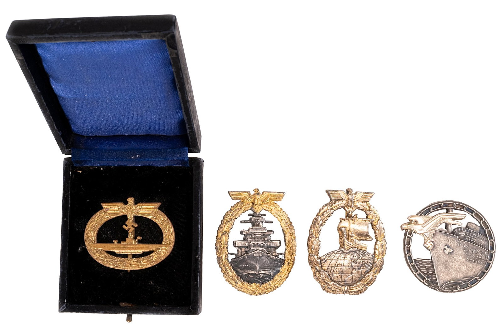WWII Nazi German Army Naval Kriegsmarine Badge Collection: WWII German Kriegsmarine Naval Badge Collection of 4X Examples Including 1X Auxiliary Cruiser Badge with Viking Ship and Globe Motif 1X Cased Submarine Badge Marked Frank & Reif Stuttgart with Blue Le