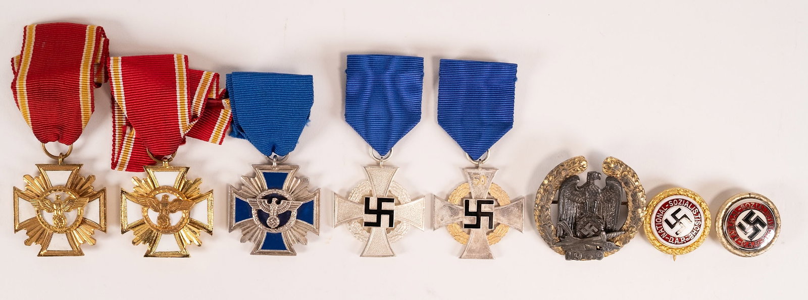 WWII Nazi German NSDAP Badges Decorations Collection: WWII Germany NSDAP Badge and Decoration Collection Consisting of (8X) Pieces Including (1X) Political Golden Party Badge Marked "Ges Gesch AH 3011939" Approximately 11875" W; (1X) Political Golden
