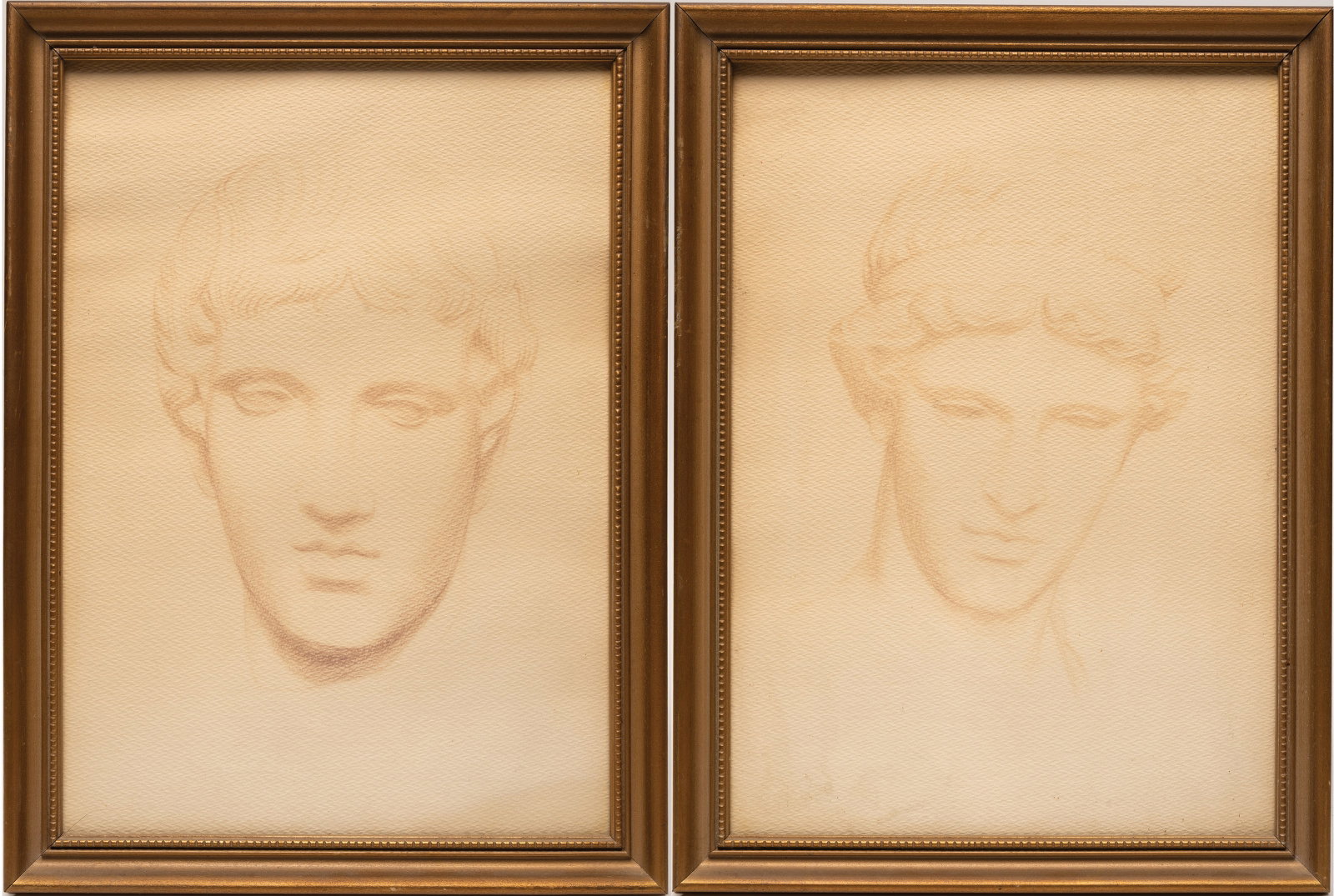 Classical Apollo Head Study Drawings Textured Artist Paper Mounted & Framed Pr: Pair of Classical Apollo Head Study Drawings Executed in Graphite Charcoal or Similar Dry Medium on Textured Artist Paper Depicting the Idealized Head of Apollo with Youthful Features Wavy Hair and Cl