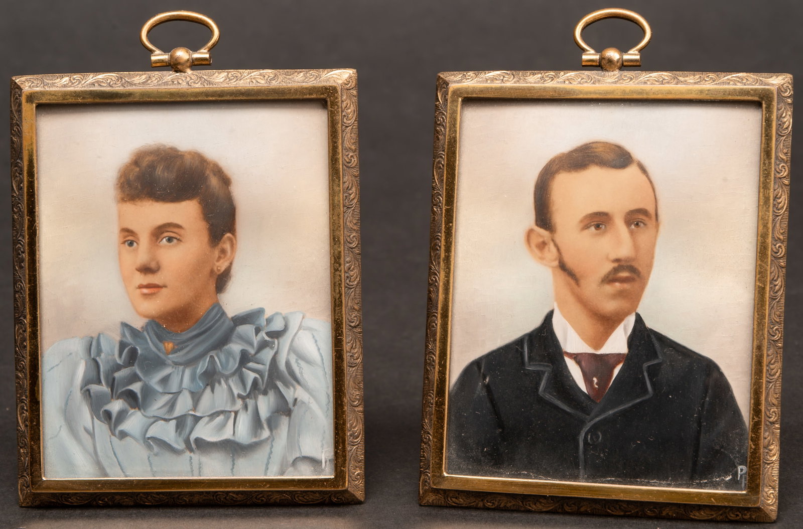 Victorian Hand-Colored Photographic Portrait Plaque Pr: Victorian Hand-Colored Photographic Portrait Plaques Pair Circa 1890 ? 1900 Depicting a Young Gentleman in Formal Attire and Young Lady in a High-Neck Ruffled Blue Dress Presented in Matching Embossed