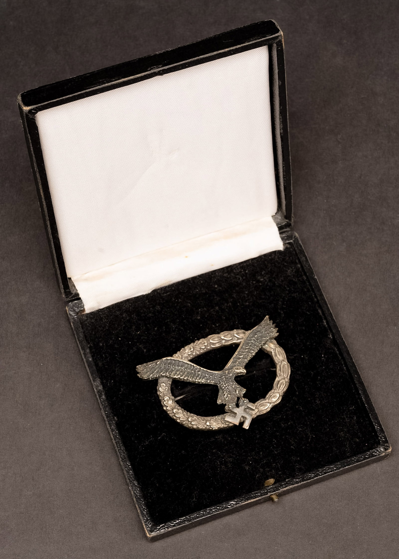 WWII German Luftwaffe CE Juncker J1 Combined Pilot & Observer Badge w/ Case: WWII German Luftwaffe Combined Pilot and Observer Badge by C.E. Juncker Berlin Early J1 Type Featuring Spread-Wing Eagle Carrying a Swastika over an Oval Oak and Laurel Wreath Reverse with Two-Piece T