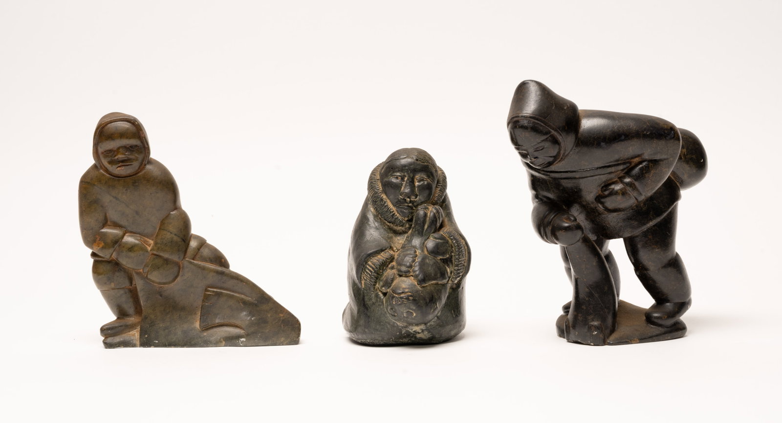 20th c. Inuit Innukpak Signed Soapstone Hunter Carving Sculpture Collection Signed illegible: 20Th Century Inuit Soapstone Sculpture Collection by Innukpak Family Artists Three Hunter Figures Nunavik Canada Rare Collection of Three Mid-Century Inuit Soapstone Carvings Depicting Traditional