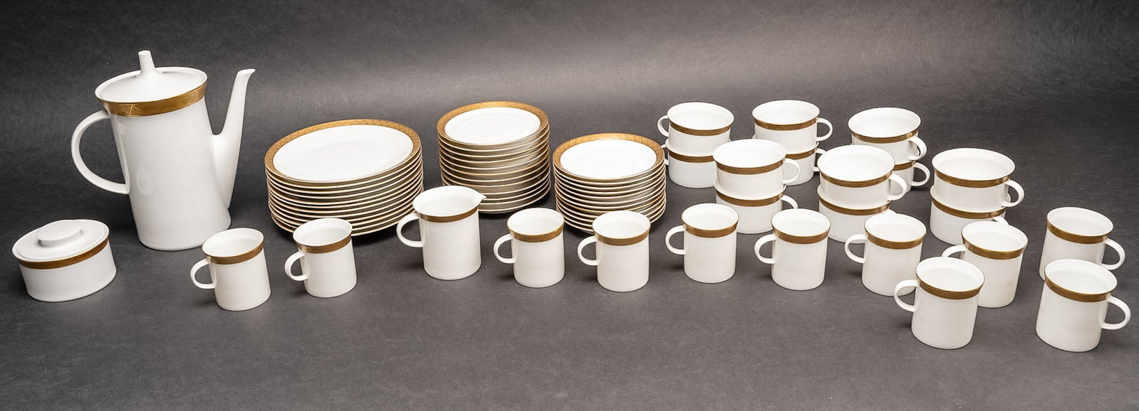 Rosenthal Germany Mid Century Modern Gold Geometric Porcelain Tea & Coffee Service for 12: Rosenthal Germany Fine Porcelain Tea and Coffee Desert Service for 12 Sixty Two Pieces Discontinued R2731 Line Crafted from Premium German Porcelain Featuring a Refined Mid Century Modern Design with