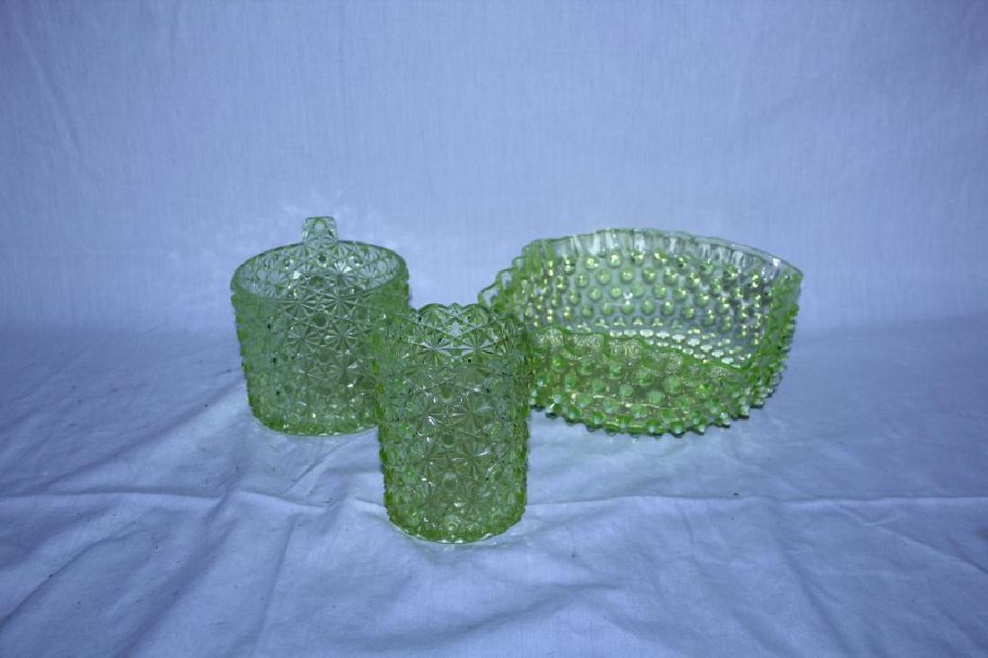 Beautiful lot of vaseline glass: This lot includes three pieces. The first is a large dish with hobnail design and measures 7" x 7 ½ " overall. The larger round planter measures 4 ¼ " round x 3 7/8 " tall and is in perfect conditio