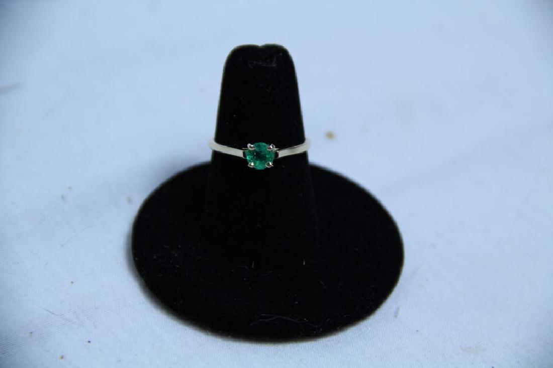 Beautiful green emerald stone set in 14k gold setting (1 of 10)