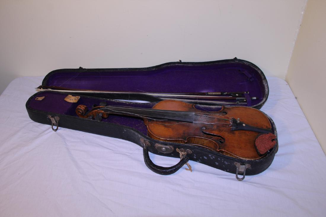 Antique violin: This appears in OK condition with one minor crack on the very bottom. This has a beautiful maple neck and is signed inside Antonius Stradiuarius and signed after that Cremonenfis and then it says Faci