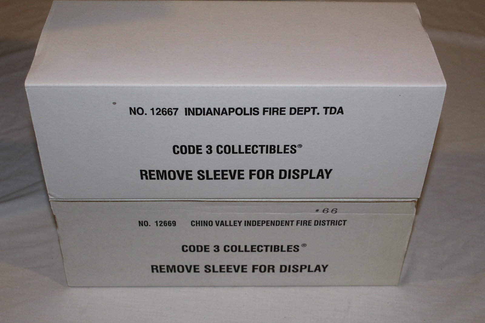 Lot of Code 3 Collectibles: This nice lot includes; item No. 12667 Indianapolis fire dept. TDA- in original box and packaging- still screwed in-appears unused. There is also item No. 12669 Chino valley independent fire district