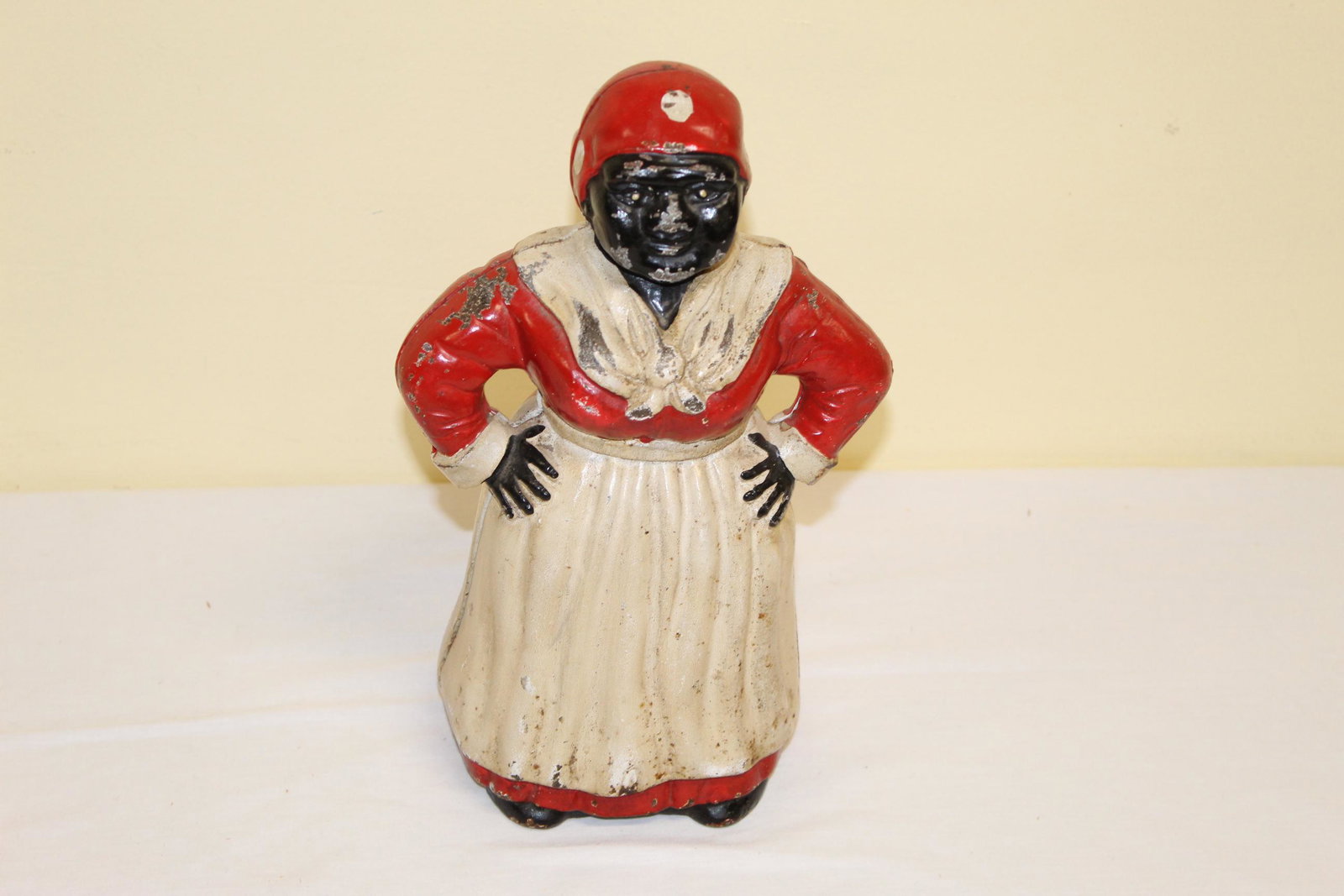 Cast iron Aunt Jemima bank door stop: This door stop measures 11in T x base is 5.5in x 4.5in overall. Nice and early bank door stop. Great overall condition. See all photos for more detail.