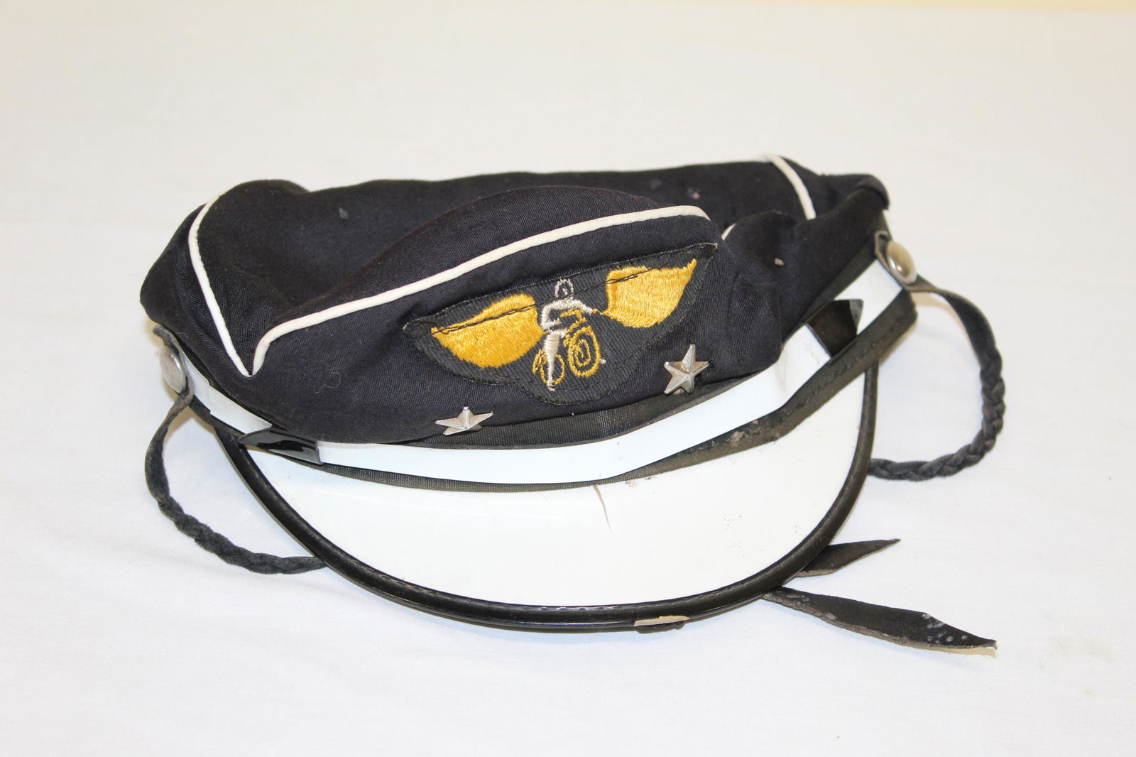 Vintage Harley Davidson Cap: This cap is circa 1940s and appears complete. There are some moth holes. Bit misshapen and there is a small crack in the white cap. Overall in good condition. See all photos for more details.