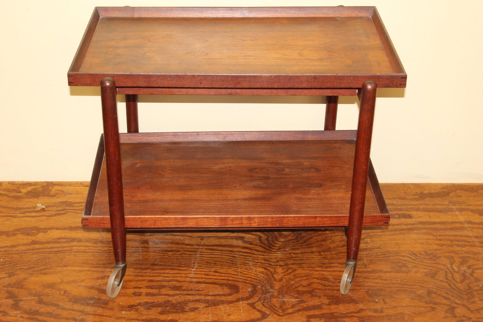 Scan Style tea cart made in Denmark: This beautiful tea cart has the sliding top and measures 23in T x 29.5in L x 20in D overall. The bottom tray does remove from this and the top tray slides. This is made out of teak wood as well. Great