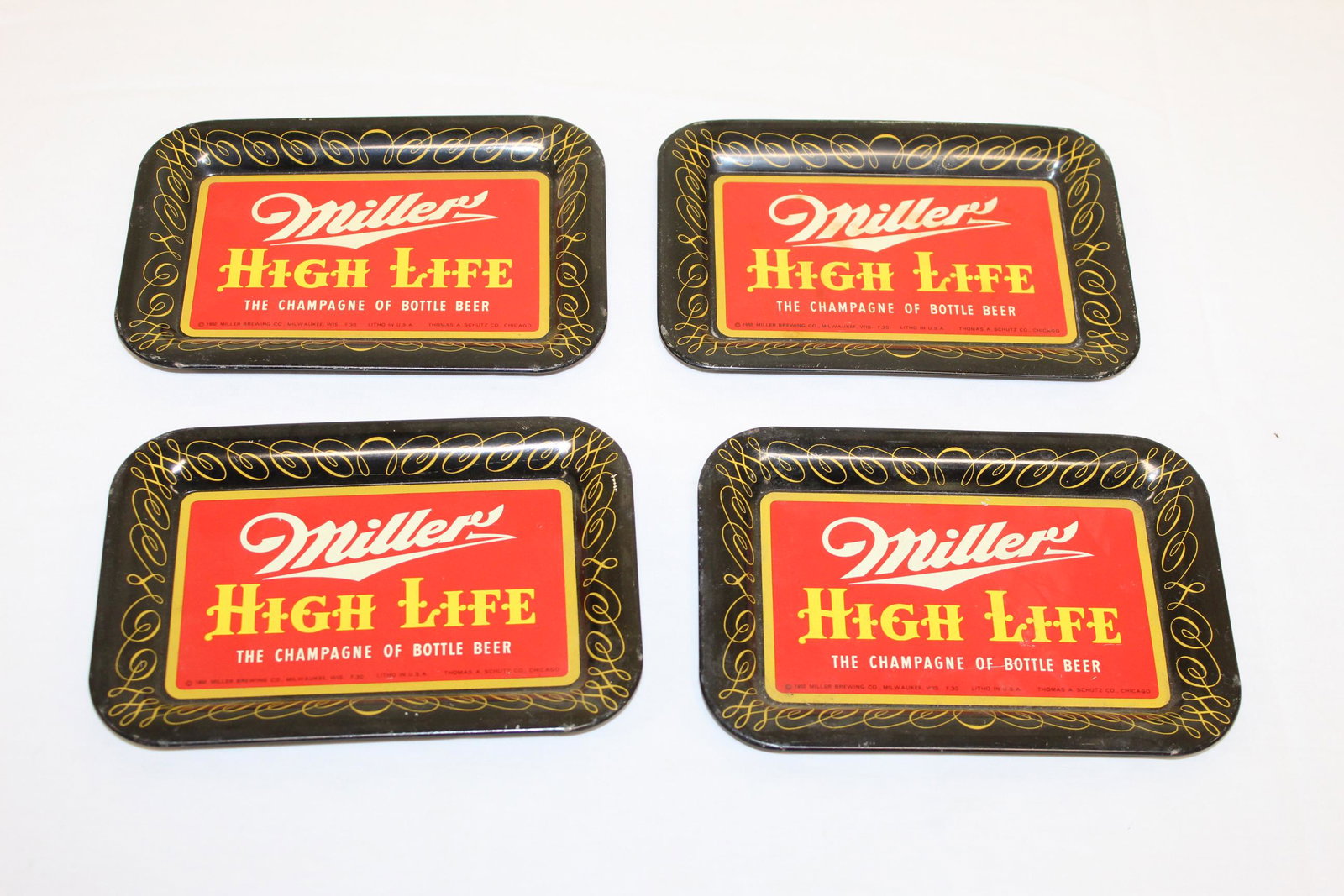 Vintage Miller High Life miniature trays: This lot includes 4 miniature trays that measure 6.5in x 4.5in overall. These read Miller high life the champagne of bottle beer. Copyright 1952 miller brewing co. Milwaukee, Wis. F.30 Litho in USA Th