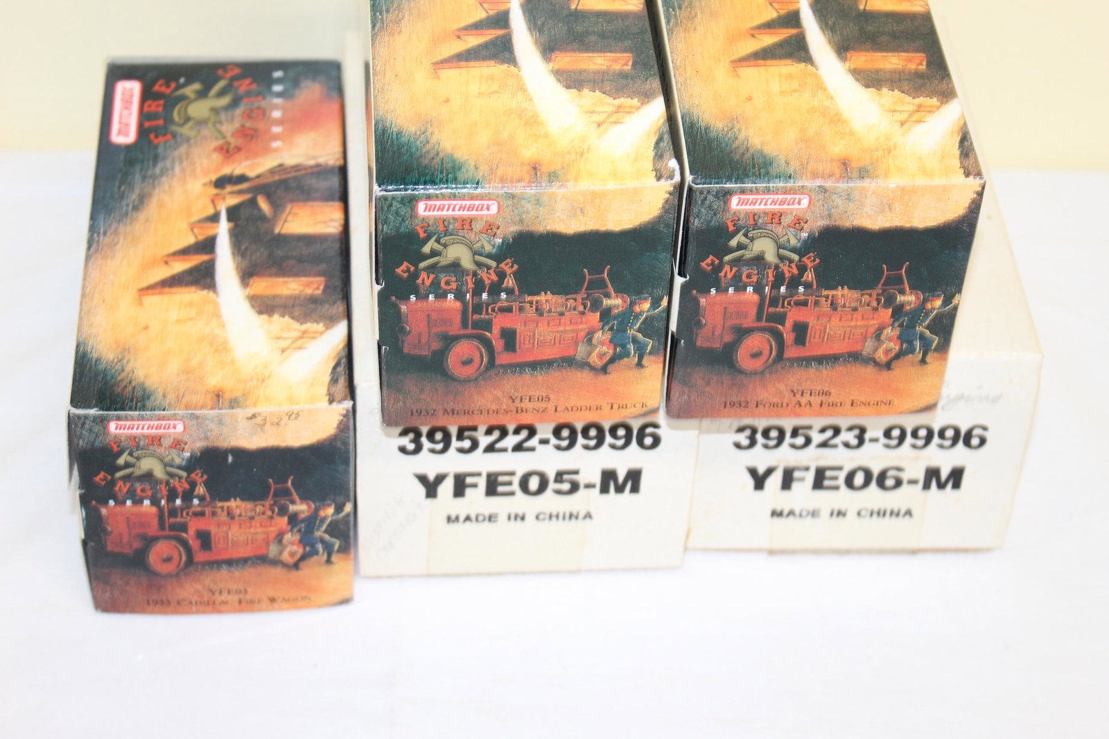 Lot of Matchbox fire engine collectibles: This lot includes 3 items all in there original boxes and packaging. Listed as follows; YFE05 1932 Mercedes-Benz ladder truck, YFE03 1933 Cadillac fire wagon, and YFE06 1932 Ford AA fire engine. Two a
