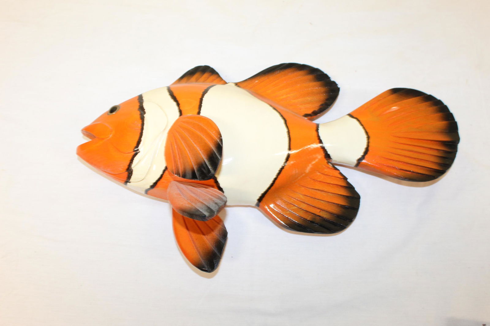 Frank Gabriel carved and painted clown fish: This beautiful clown fish is marked and signed Frank Gabriel on the back as well as reads clown fish 0016. one fin is a little loose, looks like the peg has been broken as one point, I would glue it i