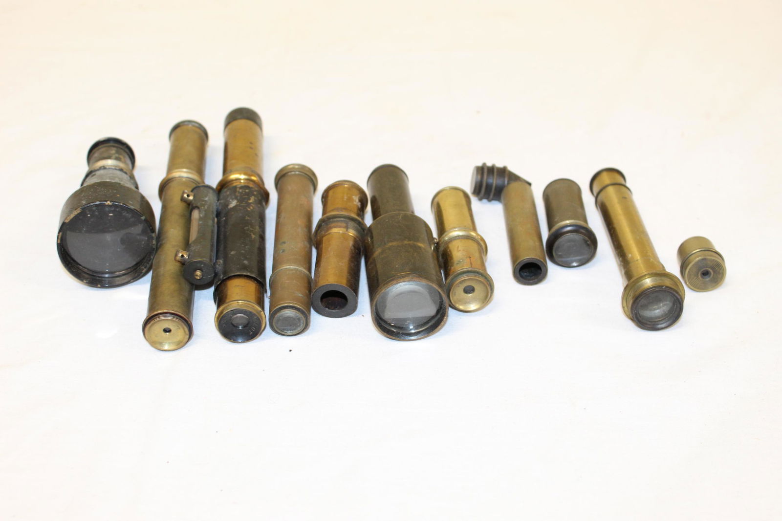 Lot of antique looking glass: This lot includes 8 looking glasses and one looking glass level? Unsure what the technical term for this piece is. All are in good used condition. The looking glass with the level is the only one with