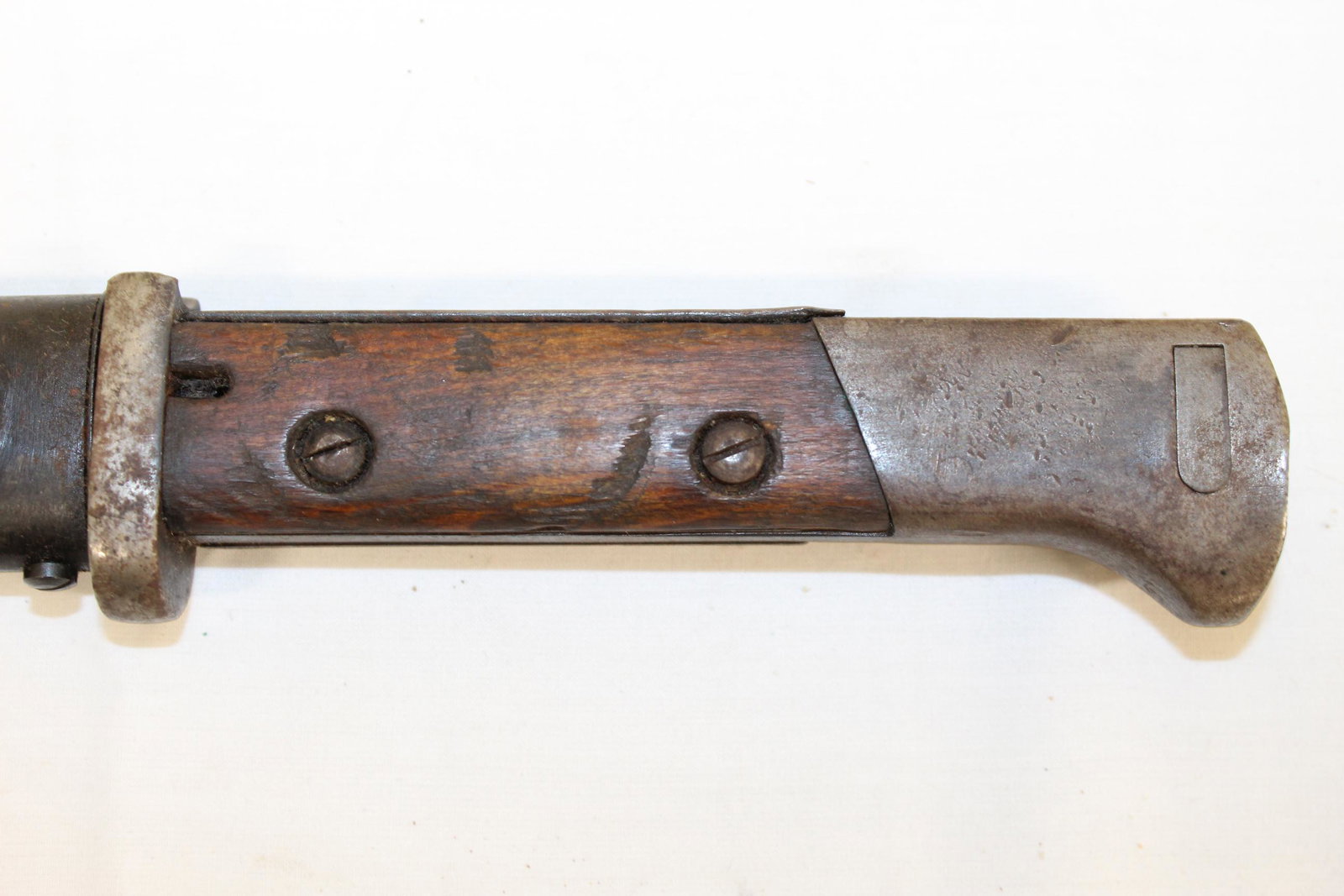 Vintage bayonet in metal sheath: This nice bayonet measures 16in L overall. Embossed on the blade W. P. H. K. P. as well as Perkun 44915. Appears to be in great overall condition with no damage or repairs seen. See all photos for mor