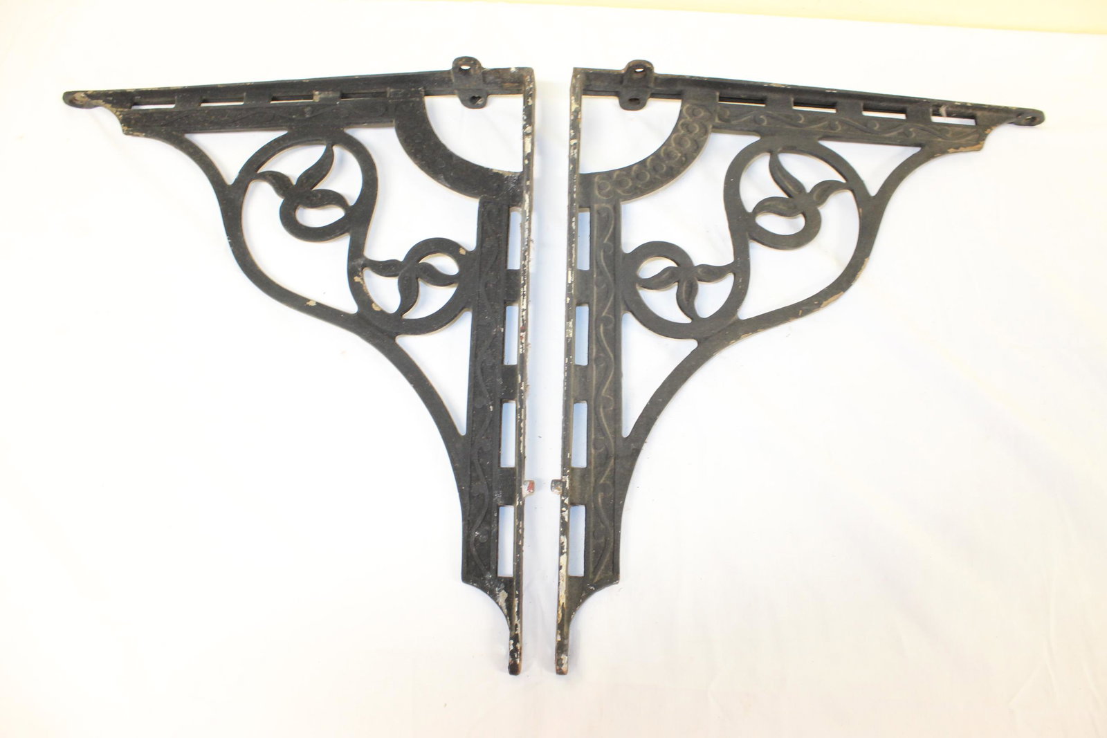 Pair of decorative metal shelf brackets: These measure 16in T x 18in W overall. There is some chipping to the black otherwise this is in great overall condition with no other damage or repairs seen. See all photos for more details. Photos sh