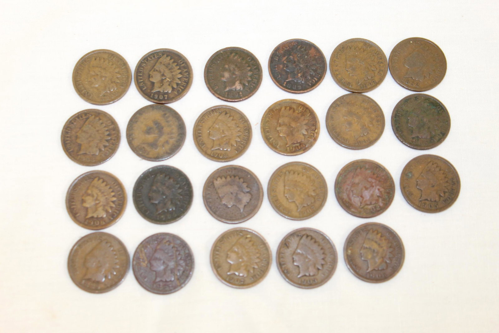 Lot of 23 Indian head pennies: There are 23 coins in this lot. Dated; 1881, 1882, 1887, (2)1889, 1891, 1892, 1895, 1902, 1903, (2)1905, (3)1906, (4)1907, (2)1908, 1909. one coin I can not read the date. There range in condition fro