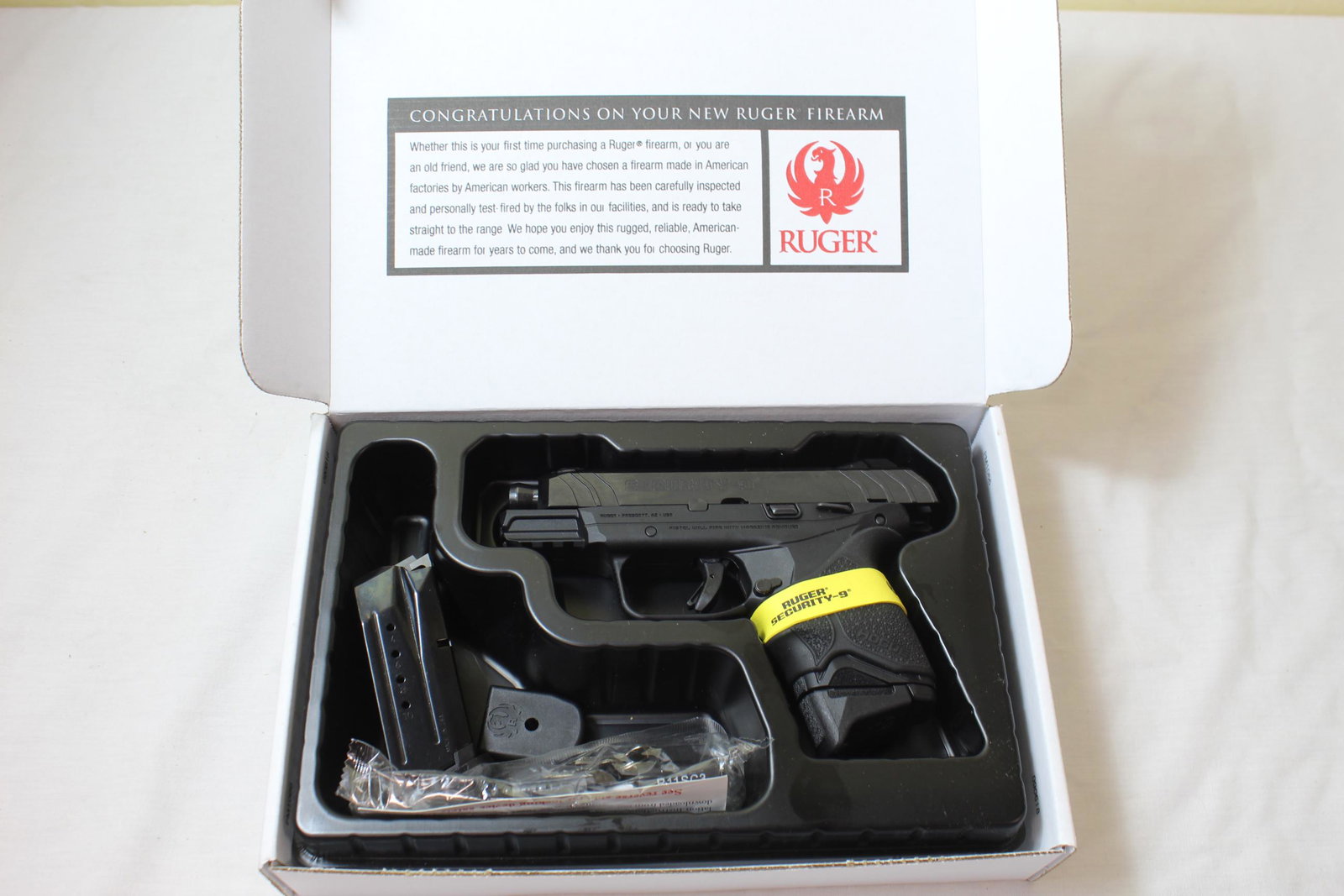 Ruger security-9 Pistol: This pistol has a serial number of 38339720. caliber is 9mm. Model security-9. Comes in the original box and is brand new. Includes clip and extra butt for the clip as well as gun lock and key. No dam