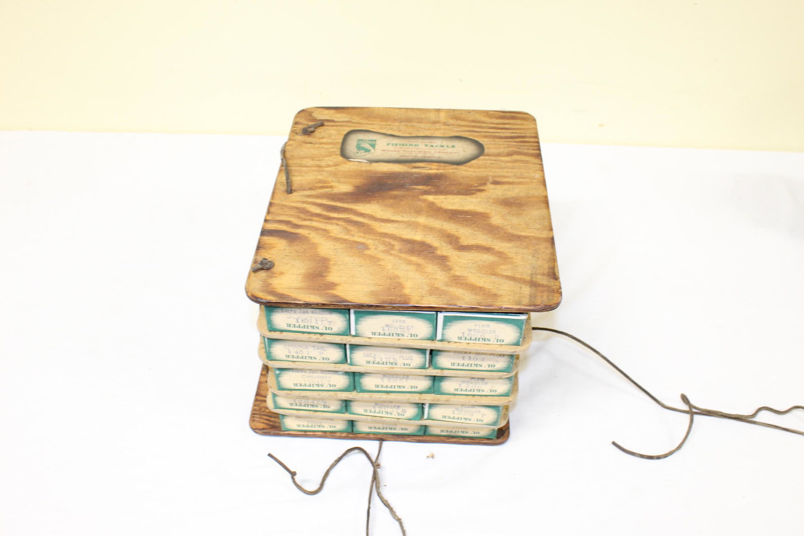 Vintage fishing box display with contents: This vintage fishing advertisement comes with original catalog Ol Skipper deluxe precision made lures. Made by the Winne Precision Co. Griffin GA. Also comes with original advertising piece and wooden
