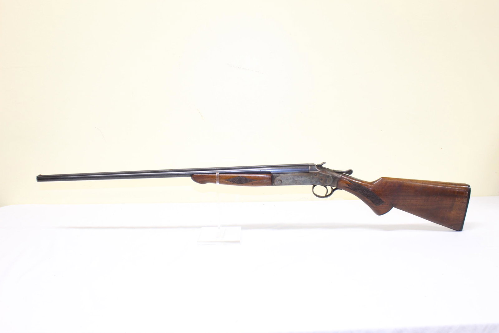 Iver Johnsons Arms Shotgun: This nice shotgun has a serial number of: 99288XE. Model unknown. Caliber is 410 GA. Matted rib. Barrel measures 26in L overall. Some roughness in one spot on the butt otherwise appears in good condit