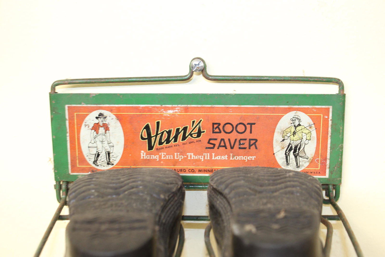 Van's boot saver advertisement: This nice vintage advertisement reads Van's boot saver hang em up theyâ€™ll last longer. Made by Noel Van Tilburg Co. Minn. This measures 8.25in W x 7in D overall. Comes with childs size boots th