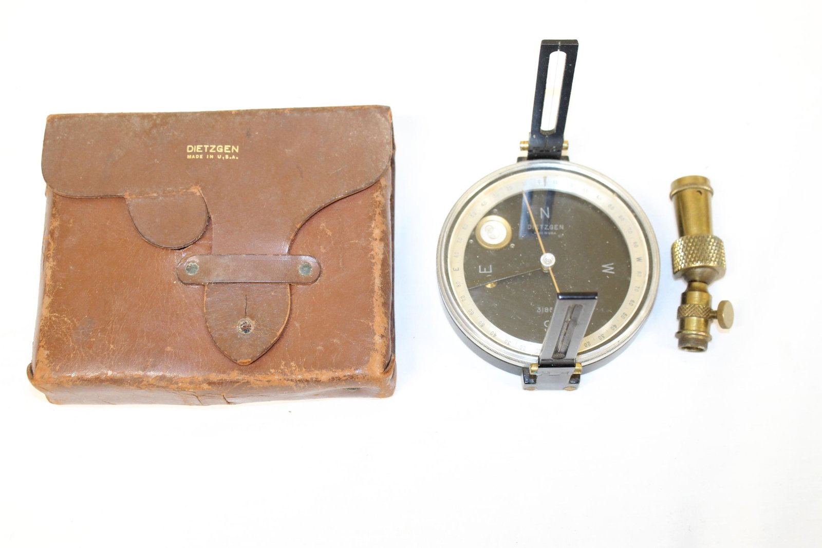Early Dietzgen compass in original leather case: This early compass is marked Dietzgen compass for surveying. This appears complete and comes in the original leather case. The compass measure 4in R overall. The leather case measures 5in T x 6.25in W