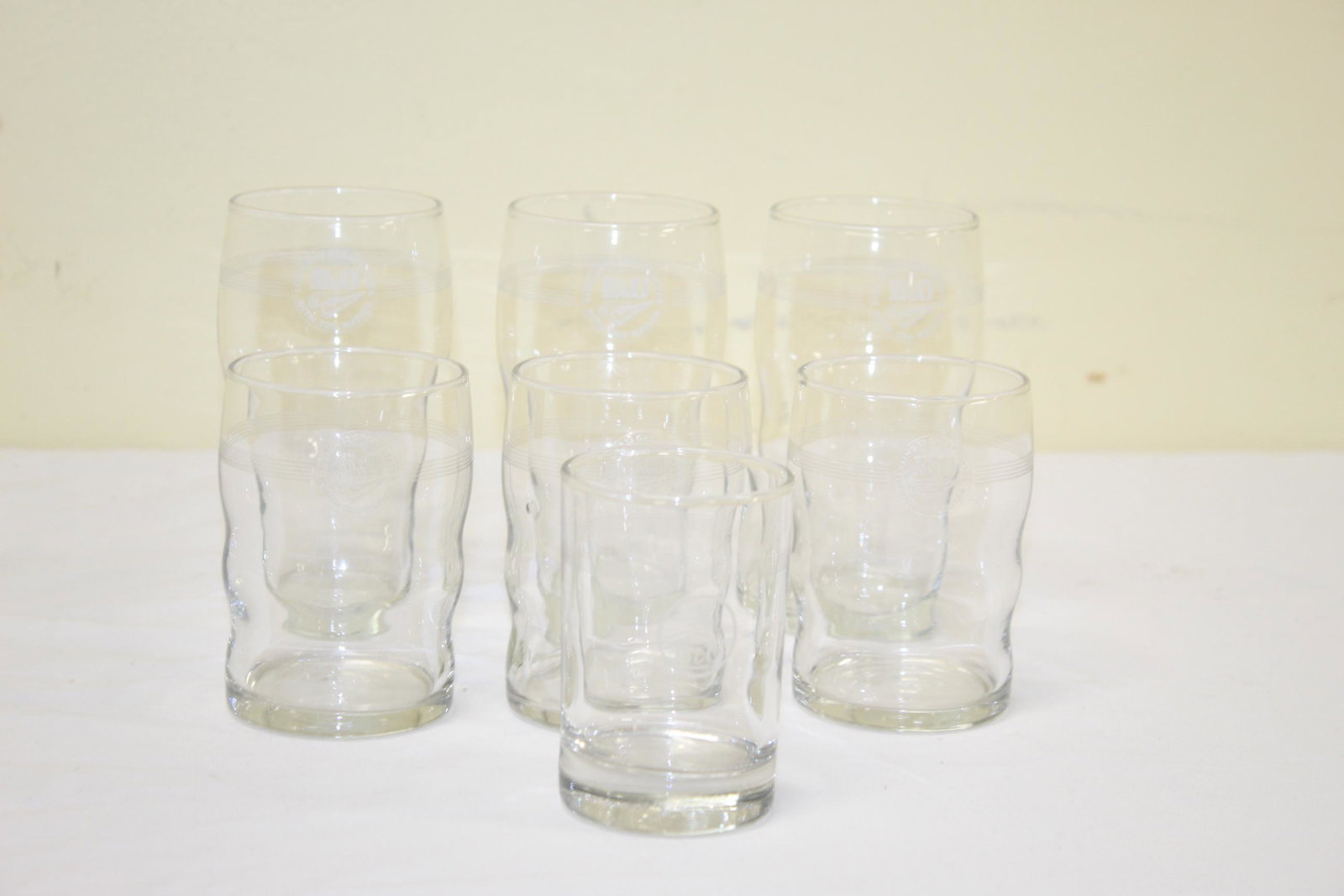 Lot of railroad glasses: The lot includes 3 tall glasses and 3 shorter and one odd small glass. These all read B & O linking 13 great states with the nation. The odd small glass only reads B & O. The tall glasses measure 5in 