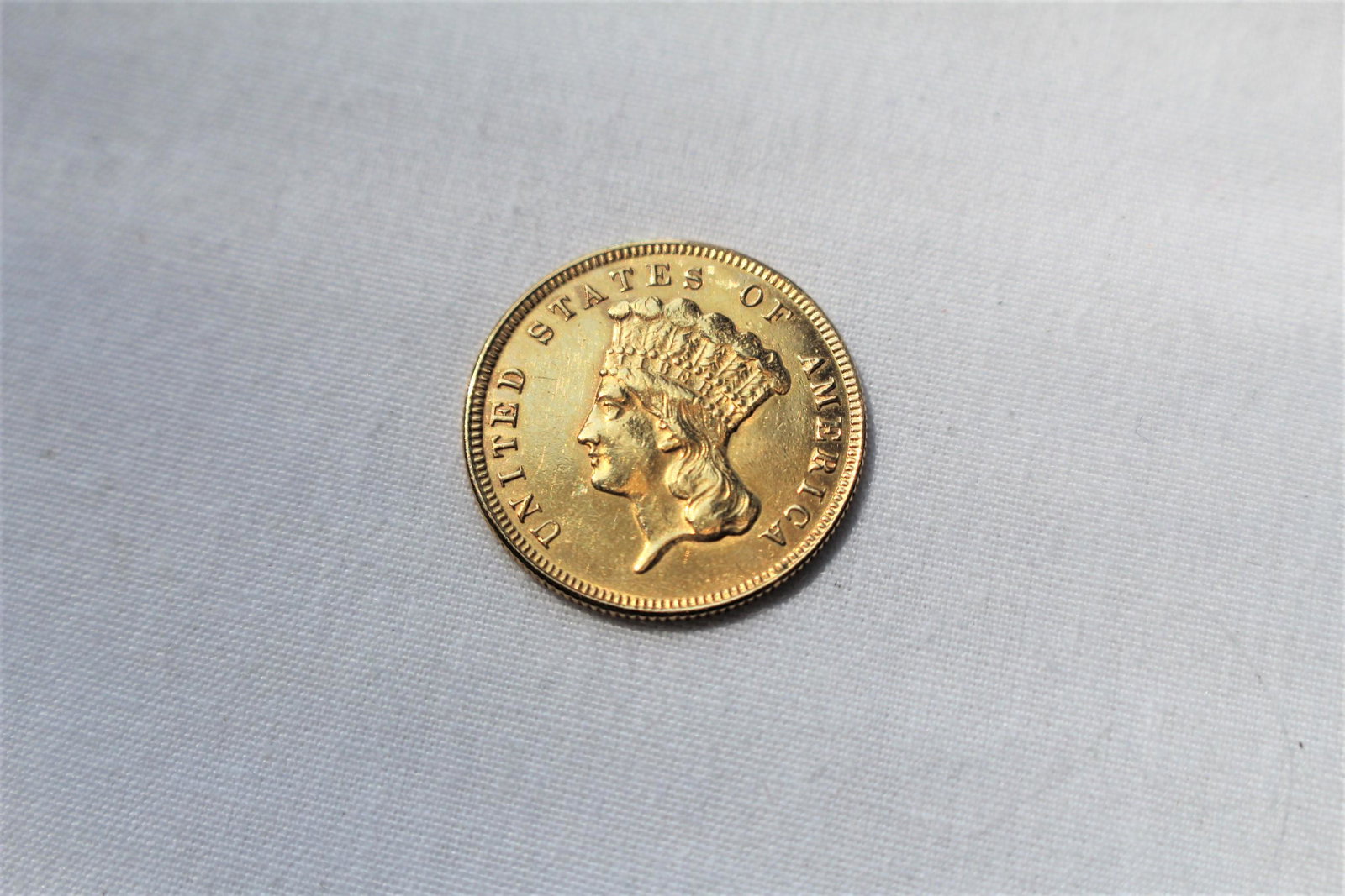 1874 Indian Princess Head Three Dollar Gold Coin: This antique Three Dollar Gold coin is an odd denomination that was first produced in 1854. Coin specs of a 1874 $3 Gold Coin are as follows: Category: Three Dollar Gold (1854-1889) Mint: Philadelphia