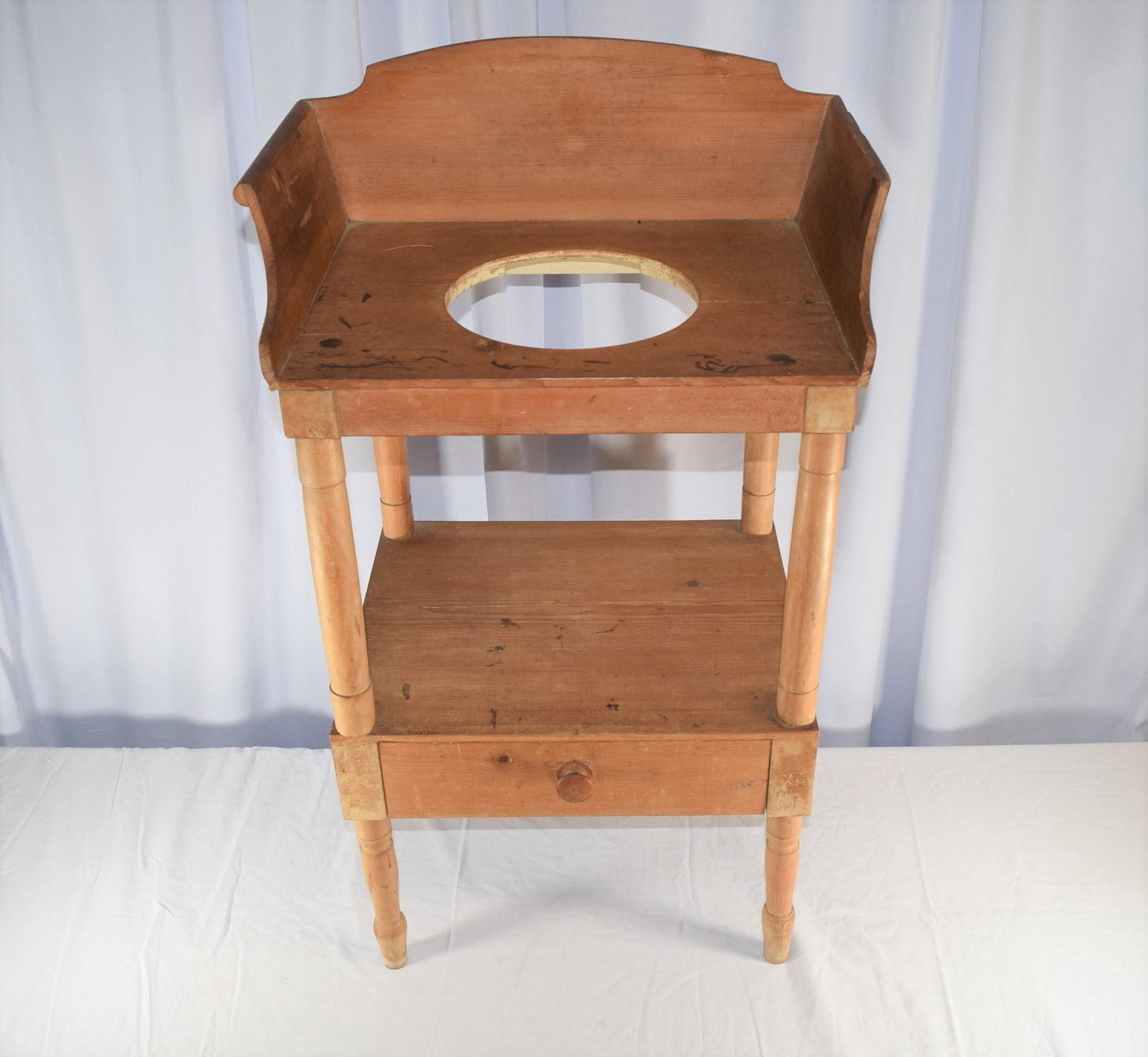 Early Country Wash Stand: This Early Country Wash Stand dates from around the 1830's, features a small drawer on bottom, and is all dovetail construction. This early washstand is in great overall condition aside from some mino
