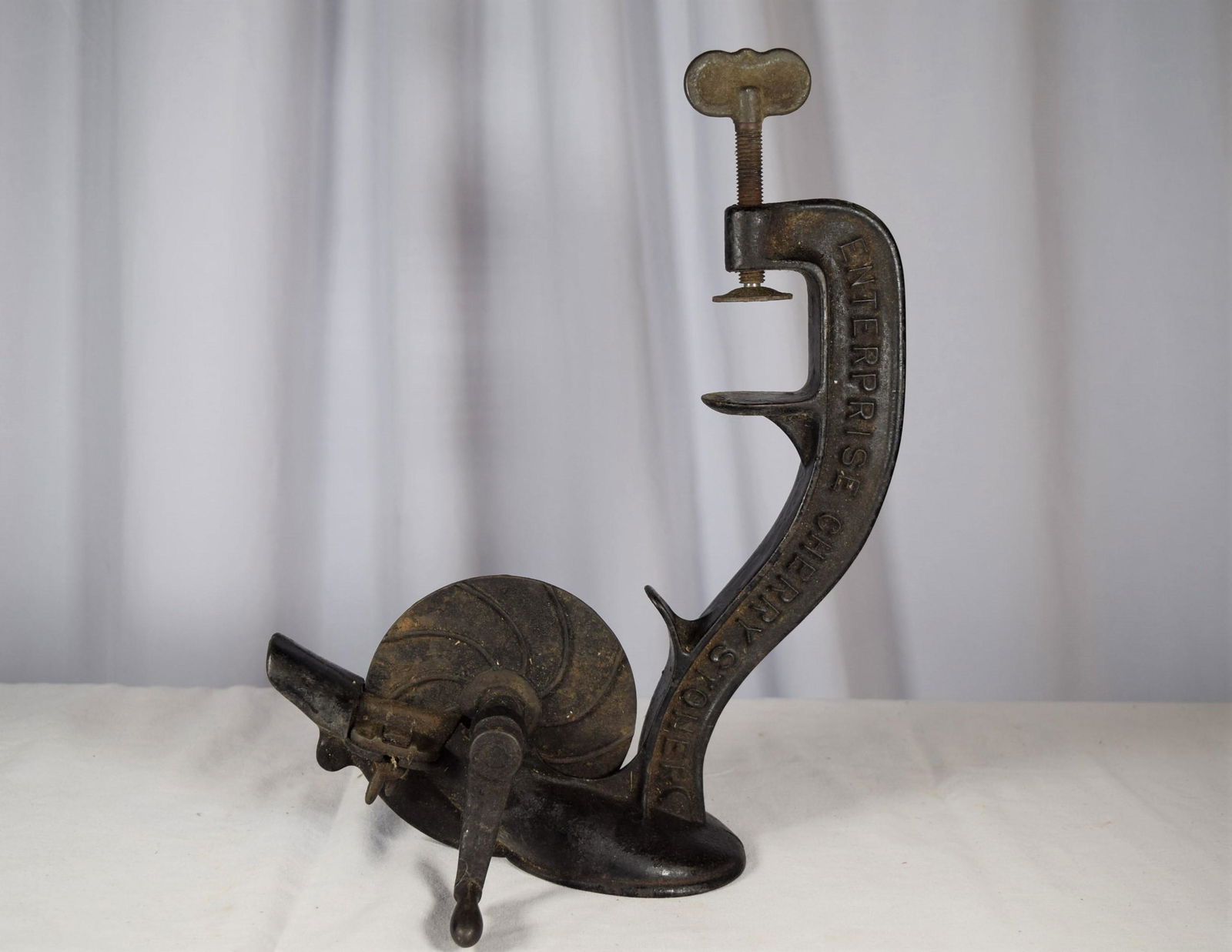 Early Enterprise Cherry Stoner: Early Enterprise Cherry Stoner, Cast Iron, In Original Black Paint. Embossed "Enterprise Cherry Stoner" on one side and on the reverse "Enterprise Mfg Co Phila USA", and along the bottom is embossed "