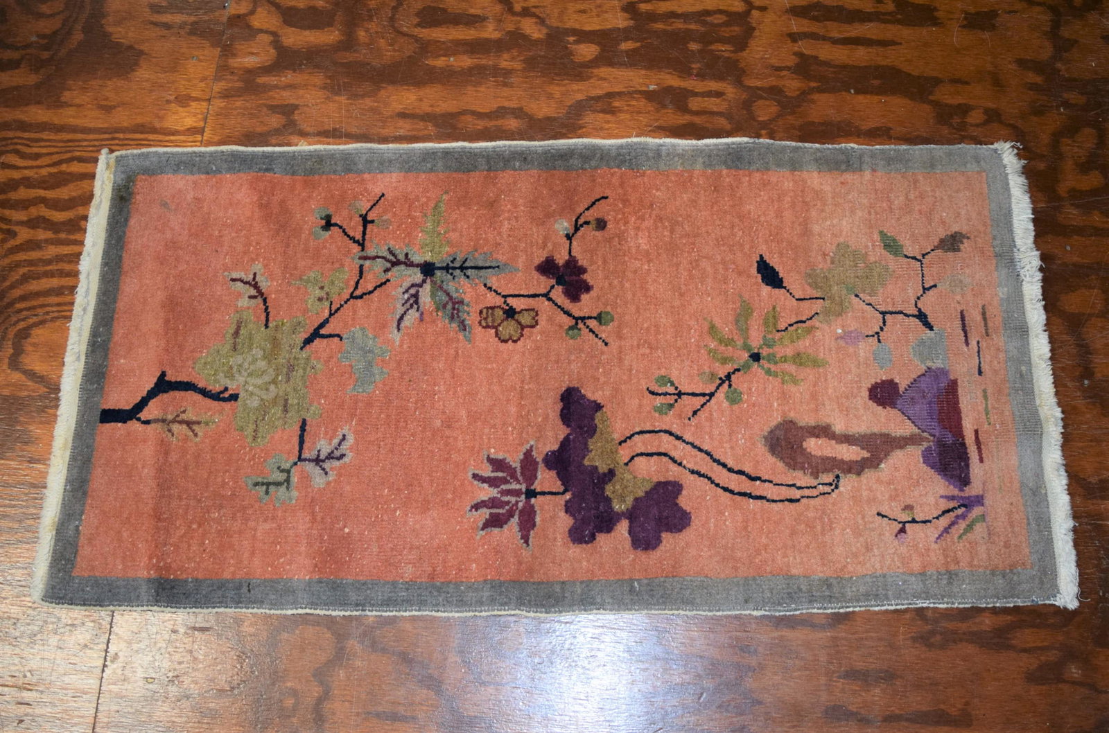 Small Area Rug: This lovely small area rug features a lovely nature/flower scene on a beautiful pale pink background with a grey border. It measures 47 inches long X 24 inches wide; does show some stains so it could 