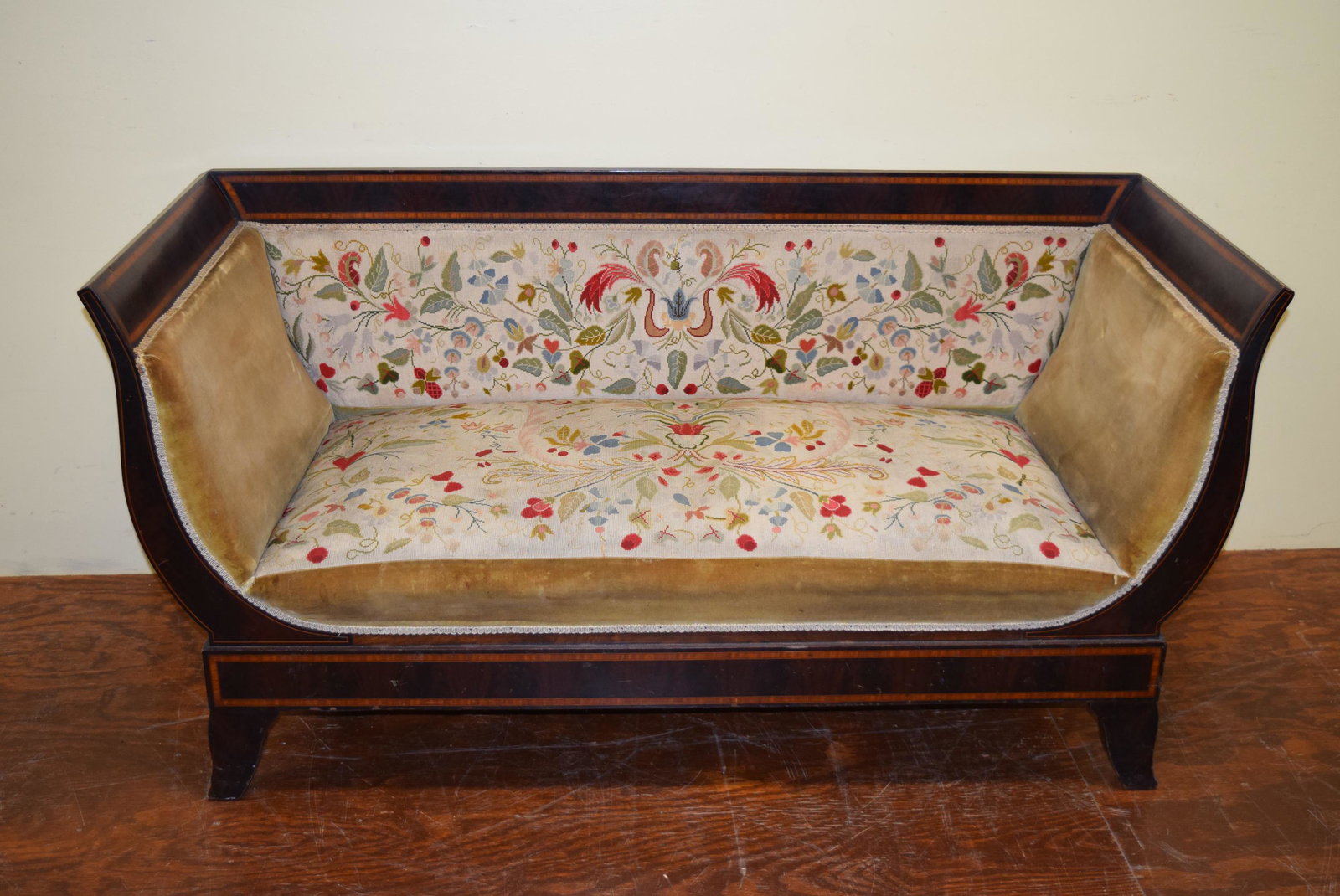 Antique Even Arm Mahogany Sofa: This beautiful sofa features inlay all around. The seat consist of needle point fabric on the seat and back with velvet sides and outline. There are a couple minor chips of inlay missing as well as so
