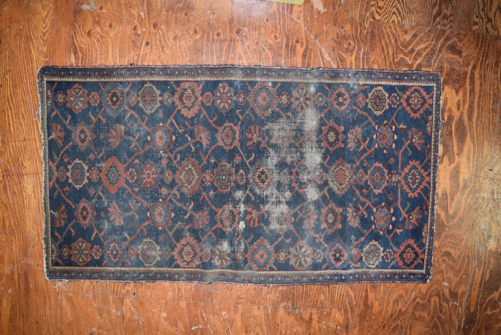 Antique Oriental Scatter Rug: This early rug is worn in areas and has a small hole as shown in photos otherwise in good condition. Measures 65.5in x 35in overall. This could use some tlc however overall would make a nice addition 