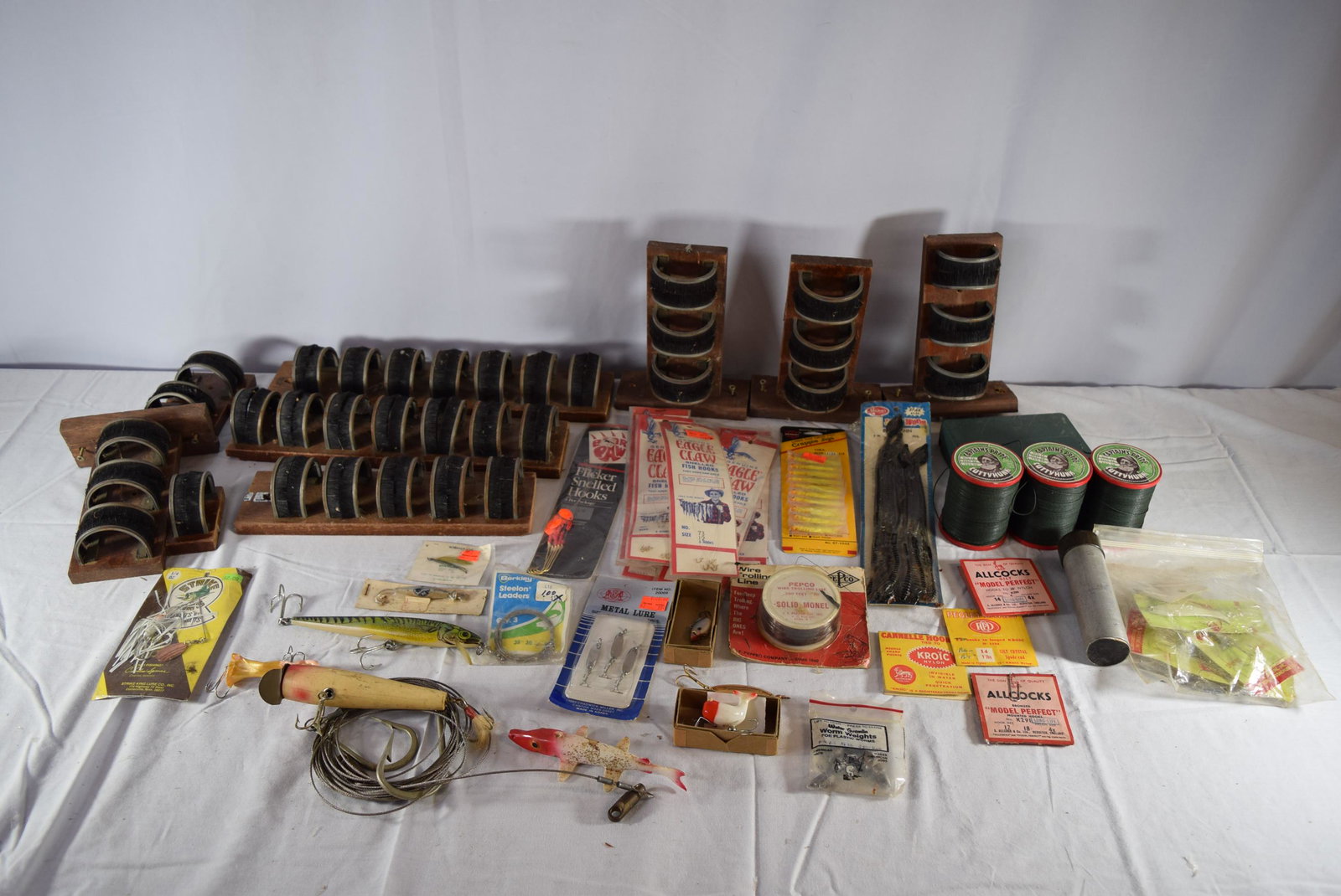 Vintage Lot of Fishing Items: This lot includes misc. fishing items such as lures, lines, boppers, hooks, and approx. 10 items that are mounted on wood and have a tag on them that read Hardy Bros. Pall Mall London. Unsure what the